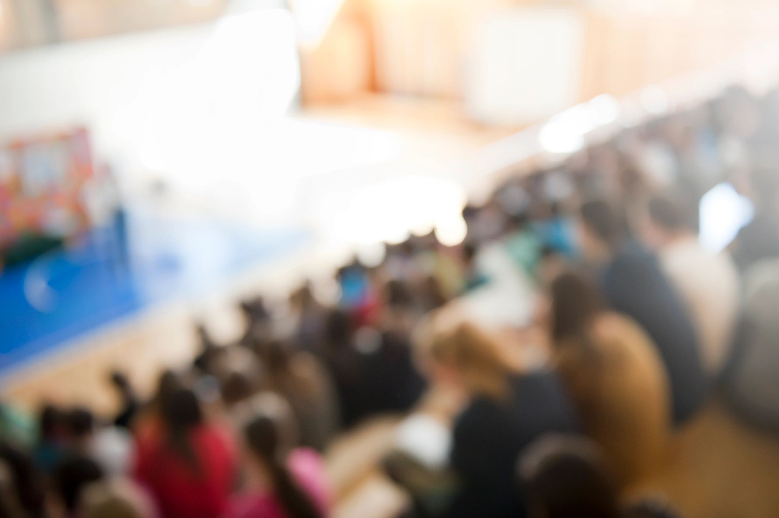 Audience at a conference listening to a presentation